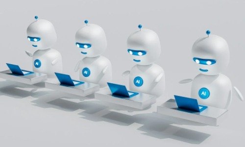 Four white robots sitting at laptops