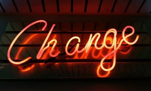 Neon sign that reads "Change"